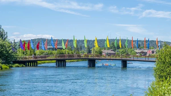 Bridge Deschutes River Old Mill District Bend Oregon Colorful Flags — Stock Photo, Image