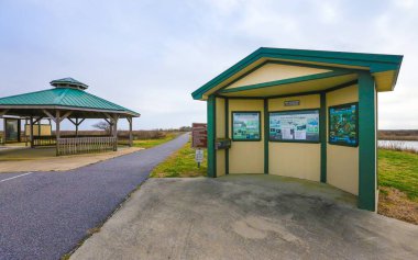 HACKBERRY, UNITED STATES - Feb 10, 2018: Hackberry, Louisiana - February 2018: The Blue Goose Nature Trail inside Sabine National Wildlife Refuge gives visitors a chance to observe nature. clipart