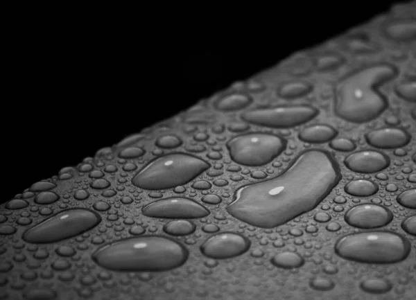 Closeup Shot Water Drops Grey Surface Black Background — Stock Photo, Image