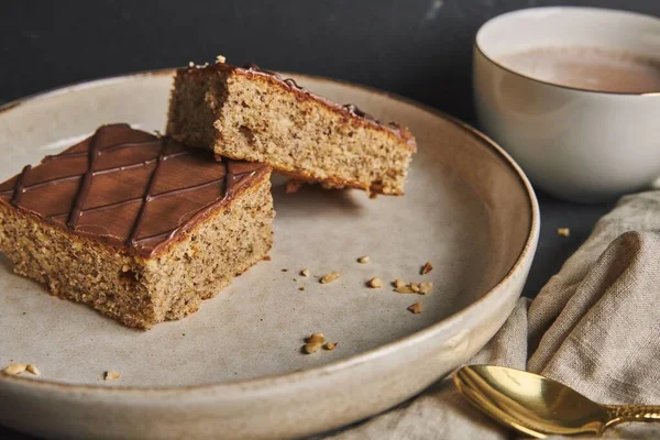 Two Slices Delicious Nut Cakes Chocolate Glaze Placed White Plate — Stock Photo, Image