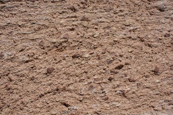 Detailní Záběr Texturovanou Podlahu Malými Kameny Slunečného Dne — Stock fotografie