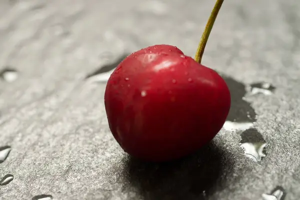 Closeup Shot Sweet Cherry Grey Stone Ground — Stock Photo, Image