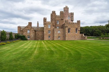 A long shot of Castle of Mey in Caithness, Scotland on a cloudy day clipart