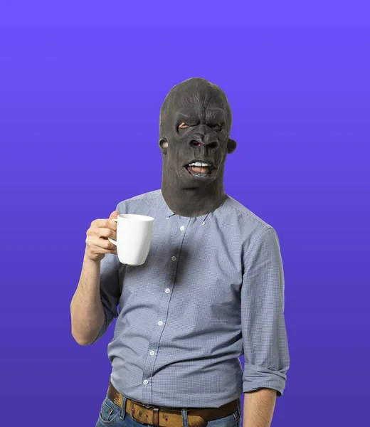 Male Black Angry Mask Holding White Cup Purple Background — Stock Photo, Image