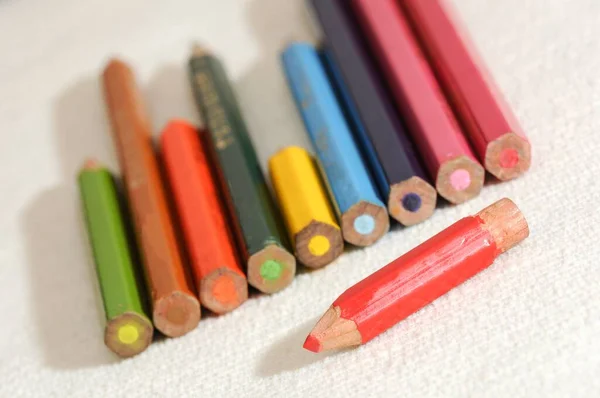 Dutch Angle Shot Colored Pencils Laid White Cloth — Stock Photo, Image