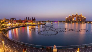 DUBAI, UNITED ARAB EMIRATES - Mar 01, 2020: This is a panoramic view at the Pointe during blue hour. clipart