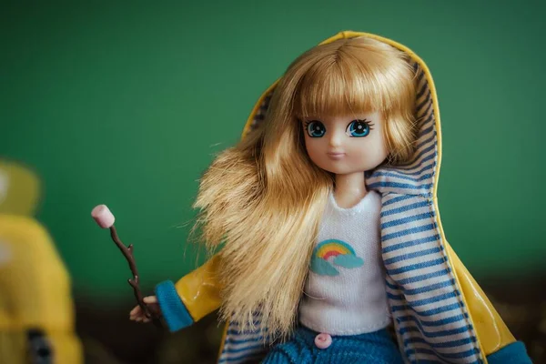 Closeup Shot Cute Hiker Doll Blonde Hair Blurred Green Background — Stock Photo, Image