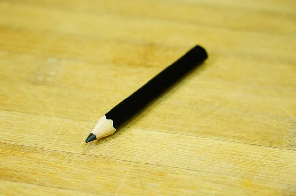 Closeup Shot Black Drawing Pencil Wooden Surface — Stock Photo, Image