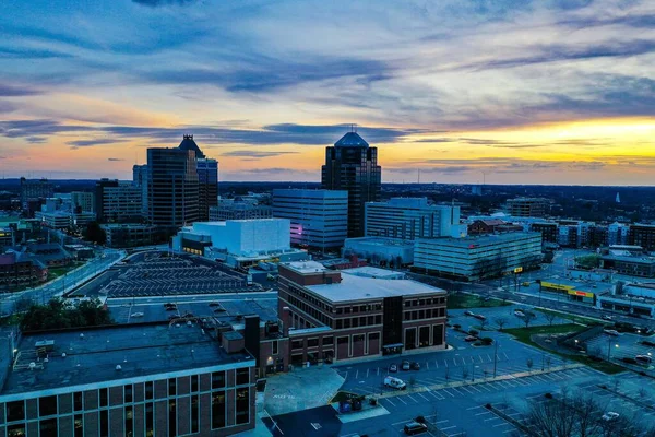 stock image A beautiful scenery of the sunset in a cloudy sky near the Greensboro skyline