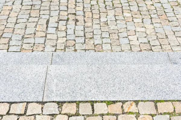 Der Hintergrund Des Alten Kopfsteinpflasters Mit Treppen Der Straße — Stockfoto