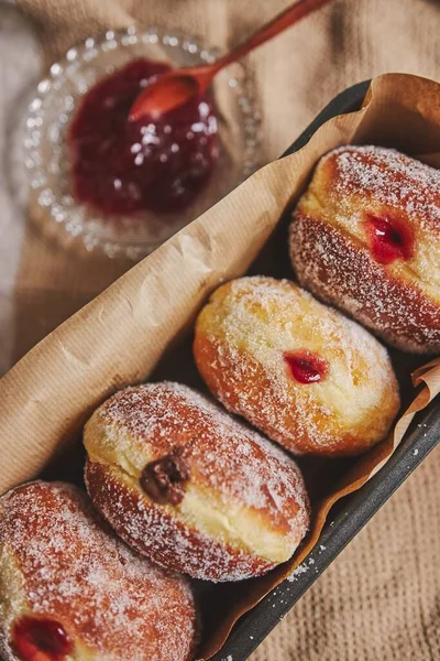 Vertical Closeup Fluffy Doughnuts Filled Jam Container Lights — Stock Photo, Image