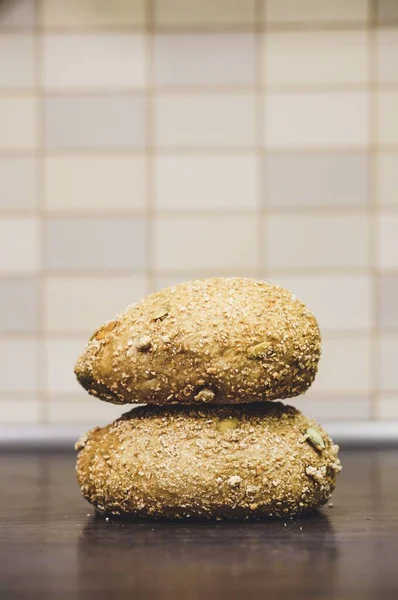 Closeup Shot Two Fresh Buns Seeds Staked Wooden Table — Stock Photo, Image