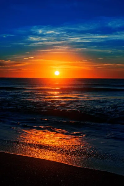 A vertical shot of the North Entrance Beach at sunrise