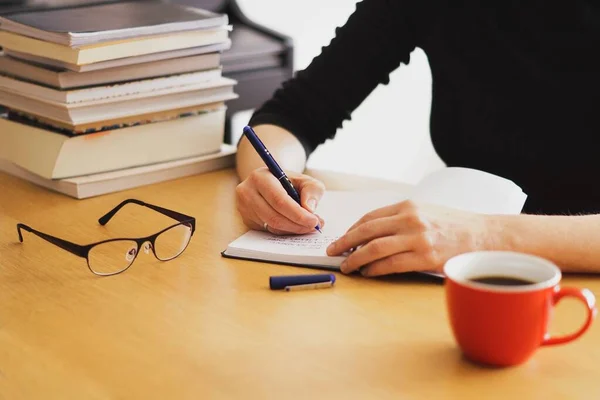 Closeup Shot Woman Working Studying Home Red Coffee Cup Nearby — Stock Photo, Image