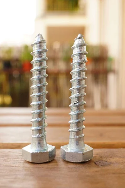 Closeup Two Screws Wooden Table — Stock Photo, Image