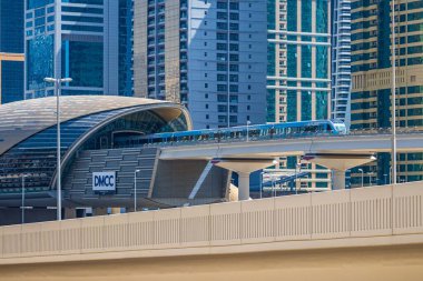 DUBAI, UNITED ARAB EMIRATES - Mar 07, 2020: A view of the DMCC Metro Station from Dubai Marina. clipart