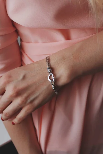 Closeup Shot Female Pink Dress Wearing Beautiful Silver Bracelet Heart — Stock Photo, Image