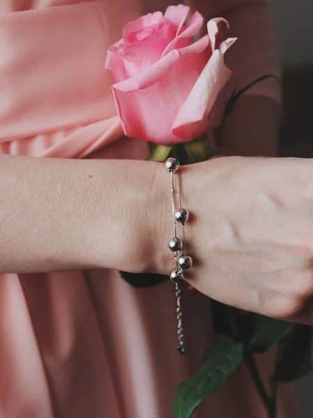 Closeup Shot Female Wearing Beautiful Silver Pendant Bracelet Holding Pink — Stock Photo, Image