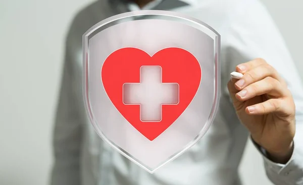 Doctor Holding Heart Red Button — Stock Photo, Image