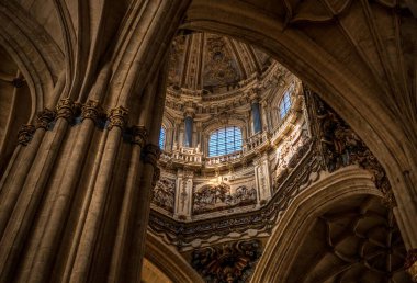 The inside view of the dome and the arches of the New Cathedral Salamanca in Spain clipart