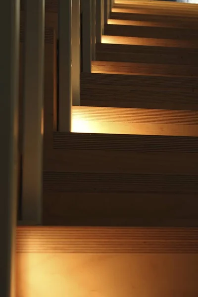 Vertical Closeup Shot Wooden Staircase Orange Lights Coming Side — Stock Photo, Image