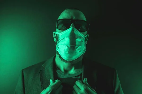 Young Man Wearing Medical Face Mask Green Light Him Concept — Stock fotografie