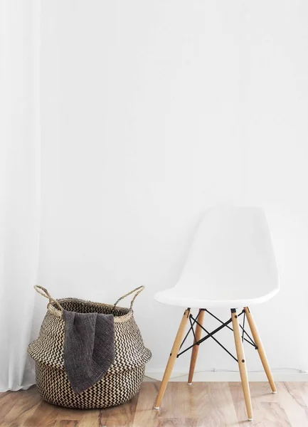 Vertical Shot White Chair Basket Clothes Front White Wall — Stock Photo, Image
