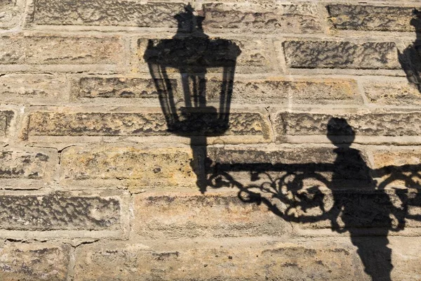 Shadow Iron Lamppost Brick Wall Stock Picture