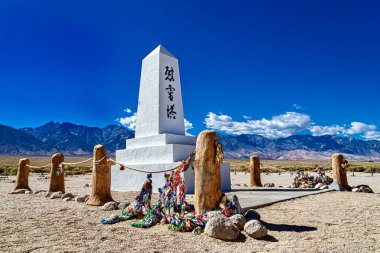 A beautiful shot of Manzanar National Park in California, USA with Sierra Nevada Mountains and a blue sky in the background clipart