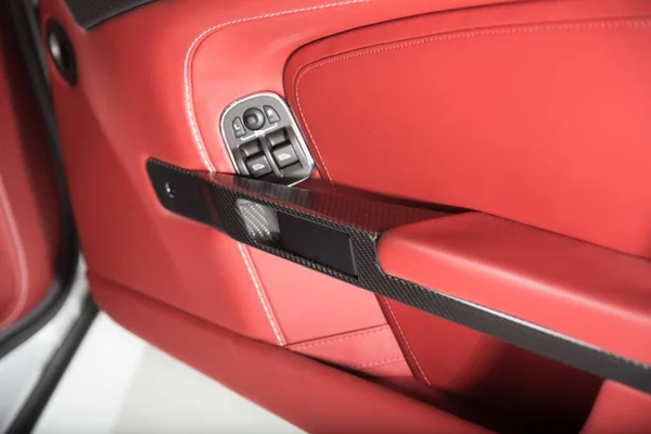 The beautiful red interior of a luxurious car with red and black details