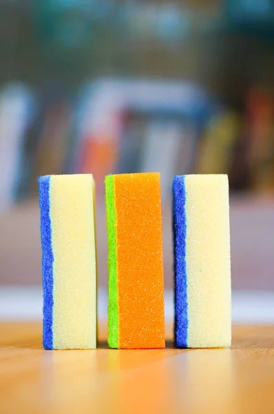 Vertical Shot Three Colorful Dish Sponges Table Lights Blurry Background — Stock Photo, Image