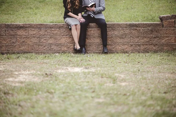 View Couple Wearing Formal Clothes Reading Discussing Book While Sitting — Stock Photo, Image