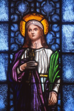 LOS ANGELES, UNITED STATES - Aug 12, 1990: Stained Glass image depicting St. Philomena, Patron Saint of youth. clipart