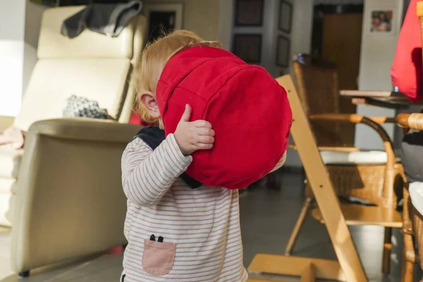 Closeup Shot Child Next Armchair Face Red Bag — Stock Photo, Image