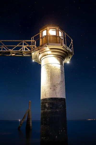 Vertical Low Angle Shot Lighthouse Captured Ocean Starry Sky — Stock Photo, Image