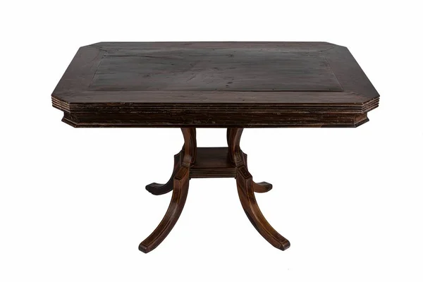 在白色背景上隔离的灯下的一张小而旧的木制桌子 — 图库照片
