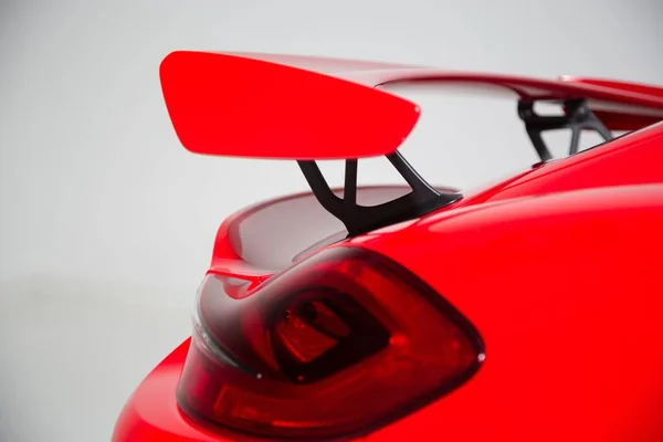 Closeup Spoiler Red Modern Sports Car Lights Isolated Grey Background — Stock Photo, Image