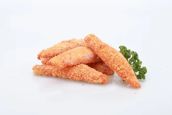 Tiro Alto Ângulo Alguns Nuggets Frango Legumes Uma Superfície Branca — Fotografia de Stock