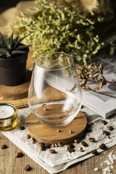 Vertical High Angle Shot Empty Glass Beautifully Decorated Wooden Table Royalty Free Stock Images