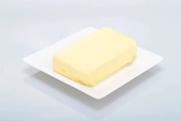 Ein Schuss Butter Auf Einem Weißen Teller Perfekt Für Den — Stockfoto