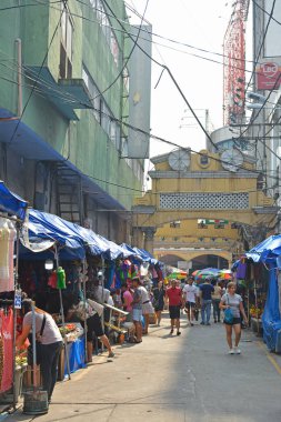MANILA, PH - OCT. 5: Hidalgo street with surrounding establishments on October 5, 2019 in Quiapo, Manila, Philippines.