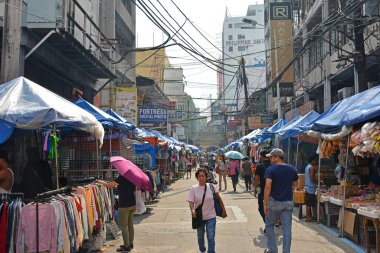 MANILA, PH - OCT. 5: Hidalgo street with surrounding establishments on October 5, 2019 in Quiapo, Manila, Philippines.