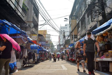 MANILA, PH - OCT. 5: Hidalgo street with surrounding establishments on October 5, 2019 in Quiapo, Manila, Philippines.