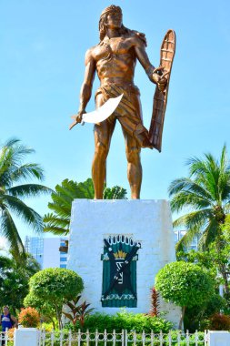 CEBU, PH - OCT. 8: Lapu Lapu Shrine on October 8, 2016 in Mactan Island, Cebu, Philippines. The Lapu Lapu shrine is a 20 meter bronze memorial statue erected on Mactan Island, Cebu, Philippines. clipart