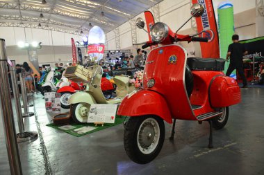 PASIG, PH - MAR. 7: Red Vespa motorcycle at 2nd Ride Ph on March 7, 2020 in Pasig, Philippines. Ride Ph is a motorcycle exhibit in the Philippines.