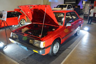 28 Temmuz 2019 'da Filipinler, Pasay' da Bumper 'dan Bumper Prime araba fuarında Mitsubishi Lancer. Bumper to Bumper, pazar sonrası arabaların yer aldığı bir araba fuarı..