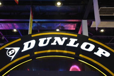 PASAY, PH - MAR 24 - Dunlop motorcycle tires sign at Inside Racing Motor Bike Festival and Trade Show on March 24, 2019 in Pasay, Philippines. clipart