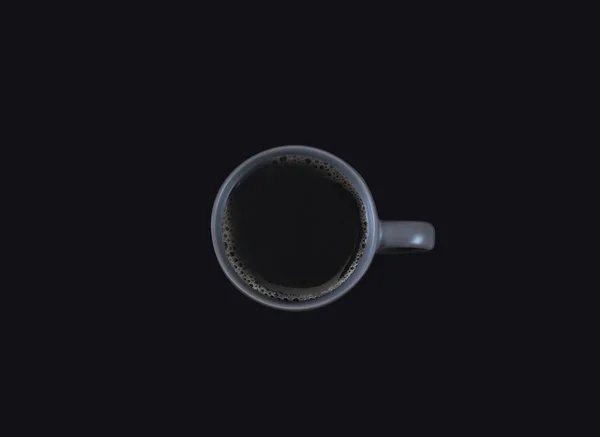 Filter coffee on grey cup, copy space on isolated dark background. Top view style — Stock Photo, Image