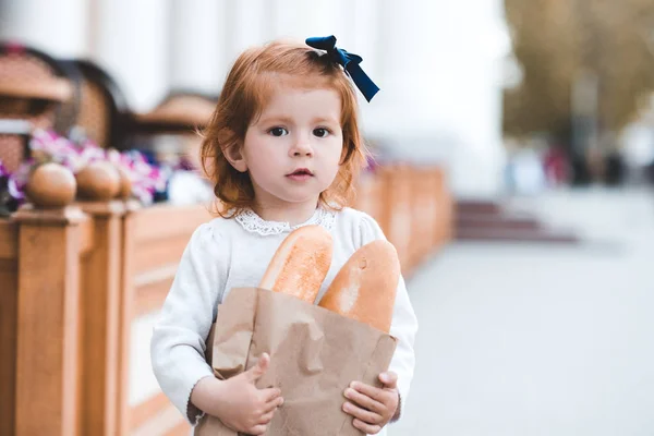 Cute Baby Girl Year Old Holding Bread Outdoors Looking Camera — Stock Photo, Image