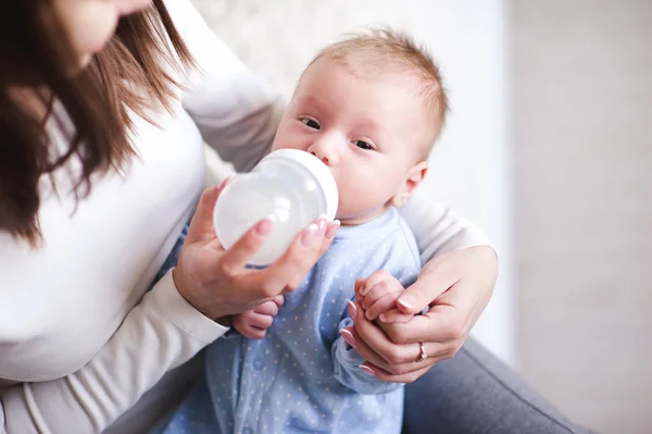 Mother Feeding Baby Boy Lying Hands Room Looking Camera Motehrhood — Stock Photo, Image